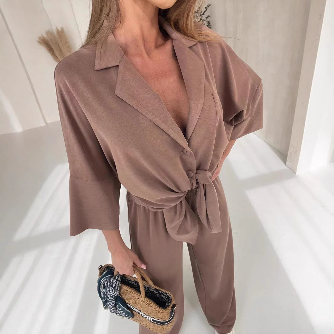 Kvinnors avslappnad jumpsuit med knytbälte och vida ben-Eva Jonsson