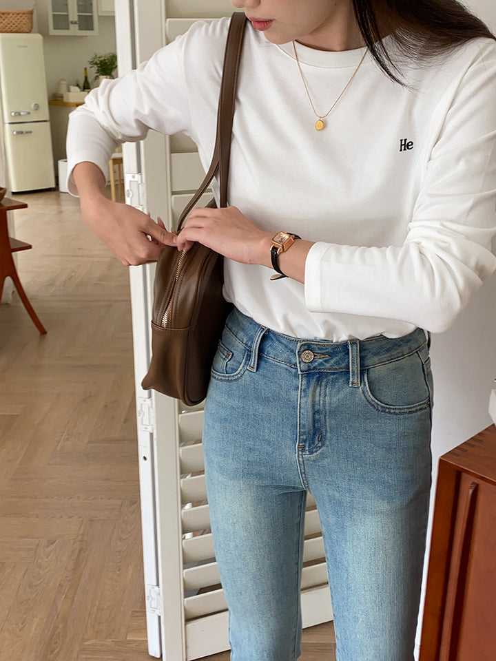 Kvinnors avslappnad långärmad skjorta med minimalistiska detaljer Mirla-Eva Jonsson