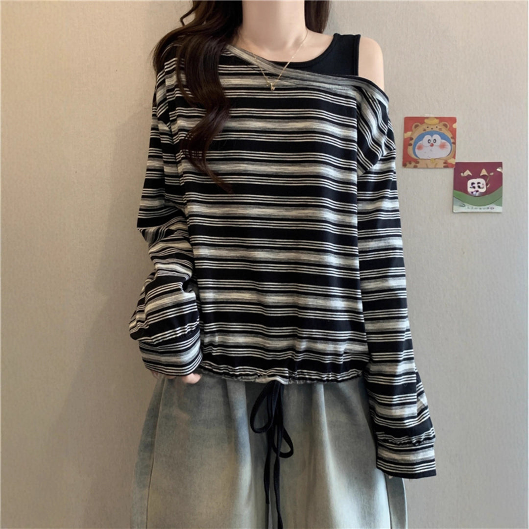 Kvinnors avslappnad långärmad skjorta med off-shoulder design Mirla-Eva Jonsson