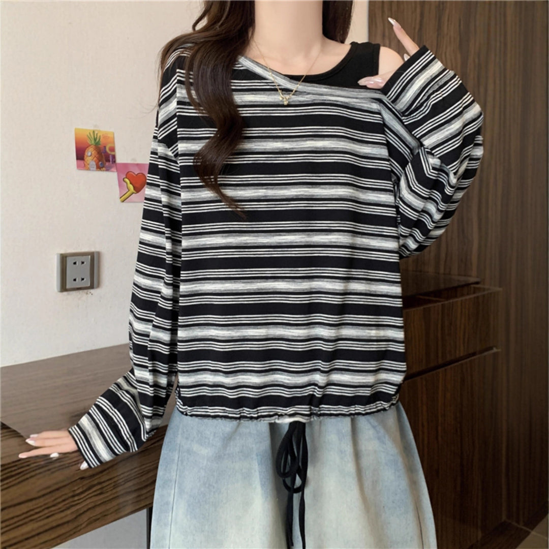 Kvinnors avslappnad långärmad skjorta med off-shoulder design Mirla-Eva Jonsson