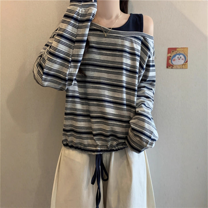 Kvinnors avslappnad långärmad skjorta med off-shoulder design Mirla-Eva Jonsson