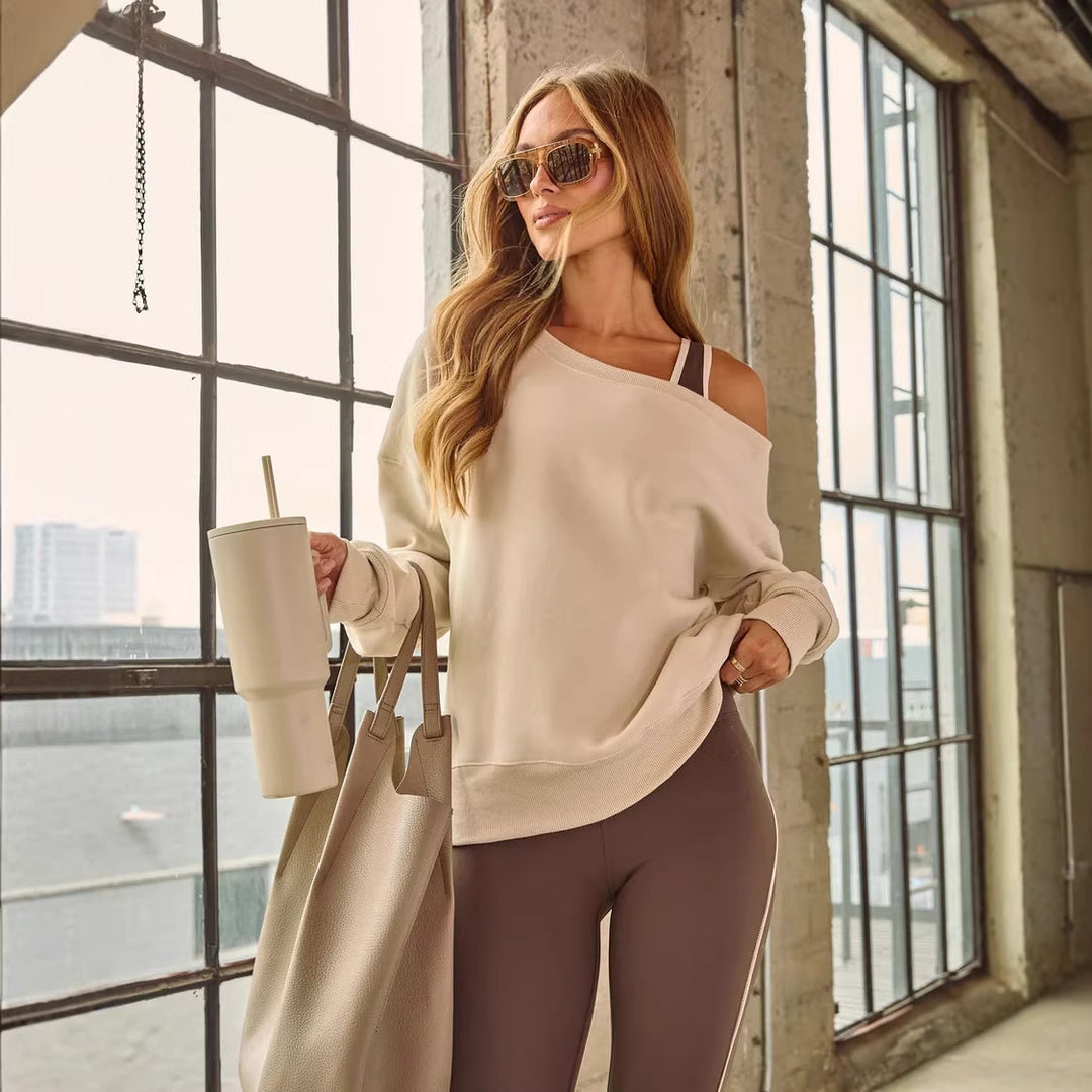 Kvinnors avslappnad off-shoulder tröja med breda ärmar och fashionabla accenter Mirla-Eva Jonsson