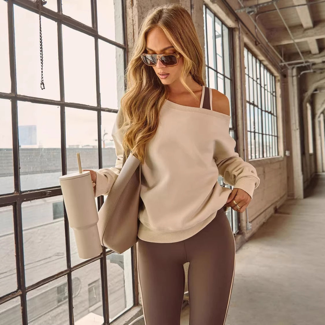 Kvinnors avslappnad off-shoulder tröja med breda ärmar och fashionabla accenter Mirla-Eva Jonsson