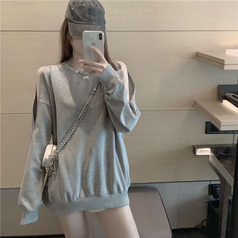 Kvinnors avslappnad oversize pullover med öppna axlar och modern design-Eva Jonsson