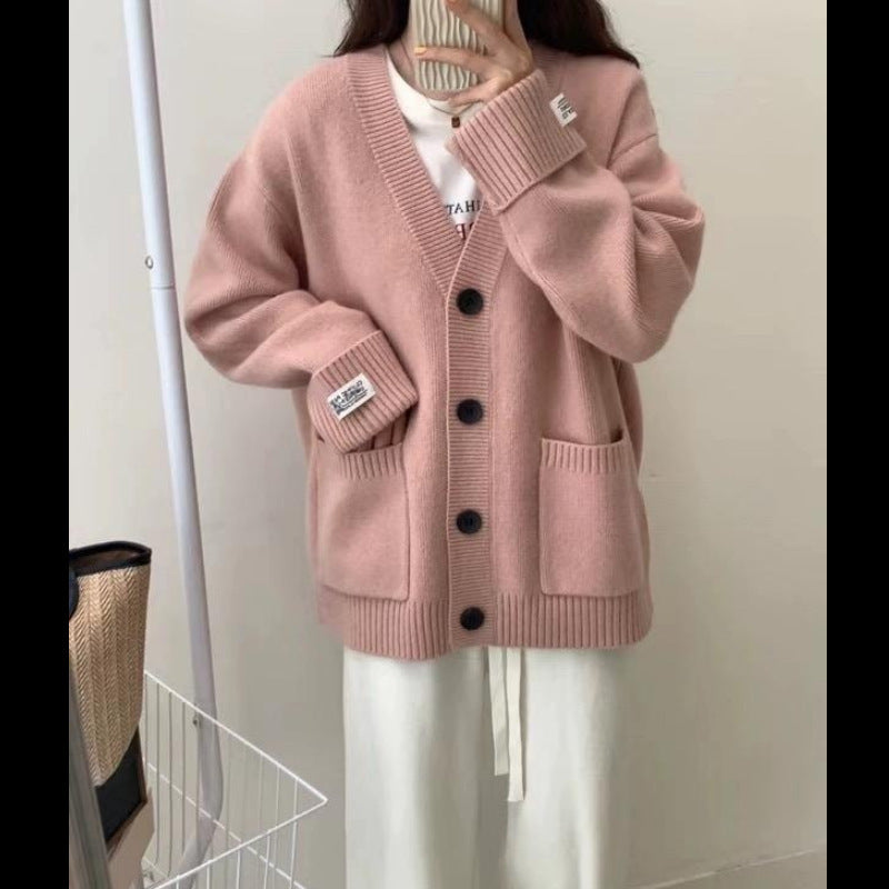 Kvinnors avslappnad oversized cardigan med stora fickor och knapppdetaljer Mirla-Eva Jonsson