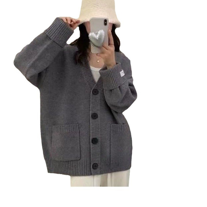 Kvinnors avslappnad oversized cardigan med stora fickor och knapppdetaljer Mirla-Eva Jonsson