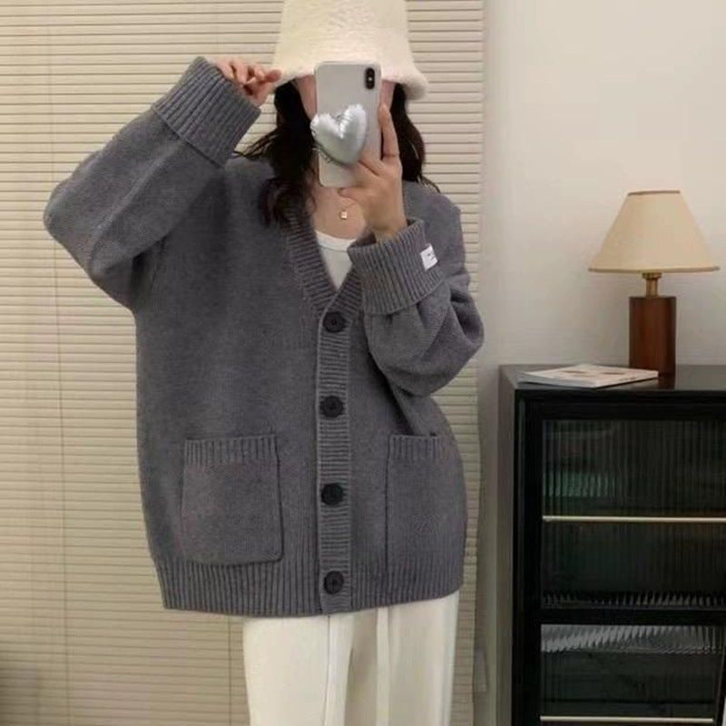 Kvinnors avslappnad oversized cardigan med stora fickor och knapppdetaljer Mirla-Eva Jonsson