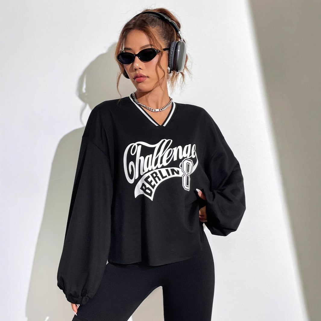 Kvinnors avslappnad oversized sweatshirt med V-hals och grafiskt tryck Mirla-Eva Jonsson