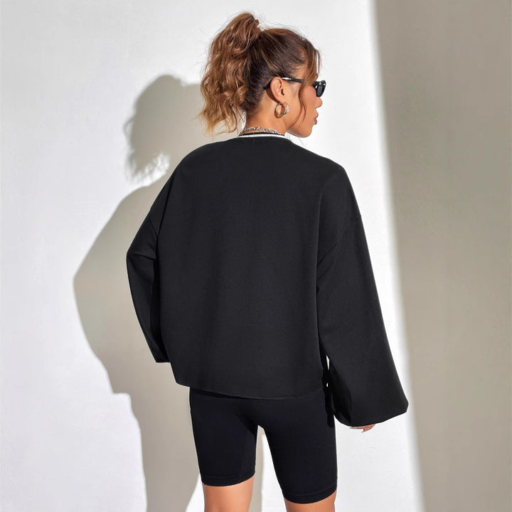 Kvinnors avslappnad oversized sweatshirt med V-hals och grafiskt tryck Mirla-Eva Jonsson