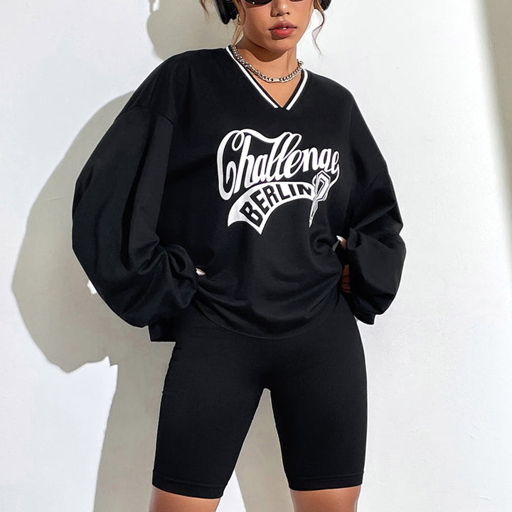 Kvinnors avslappnad oversized sweatshirt med V-hals och grafiskt tryck Mirla-Eva Jonsson