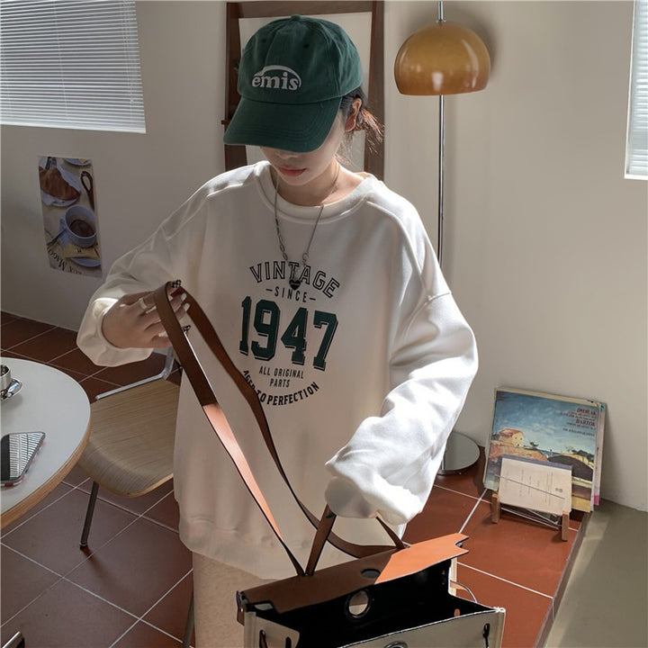 Kvinnors avslappnad oversized sweatshirt med vintage tryck Mirla-Eva Jonsson