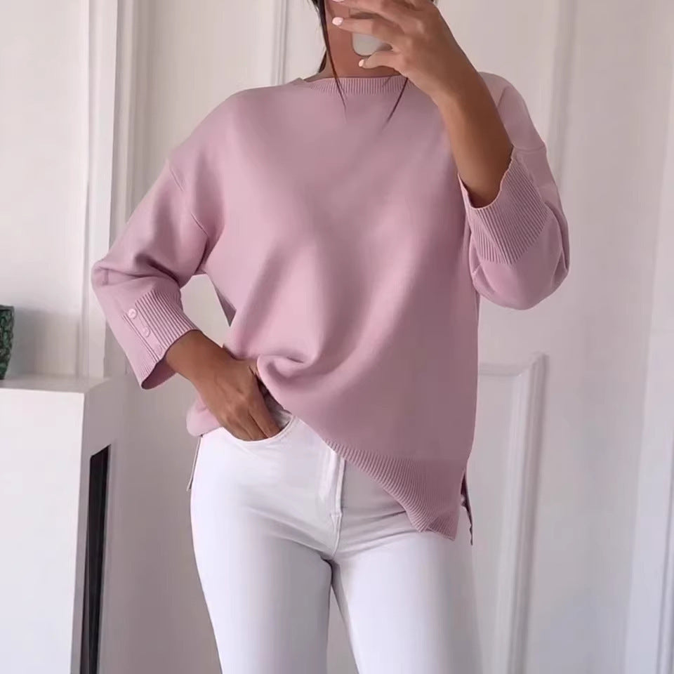 Kvinnors avslappnad oversized tröja med asymmetrisk skärning och knappdetaljer Mirla-Eva Jonsson