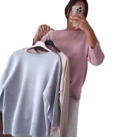 Kvinnors avslappnad oversized tröja med asymmetrisk skärning och knapppdetaljer Mirla-Eva Jonsson
