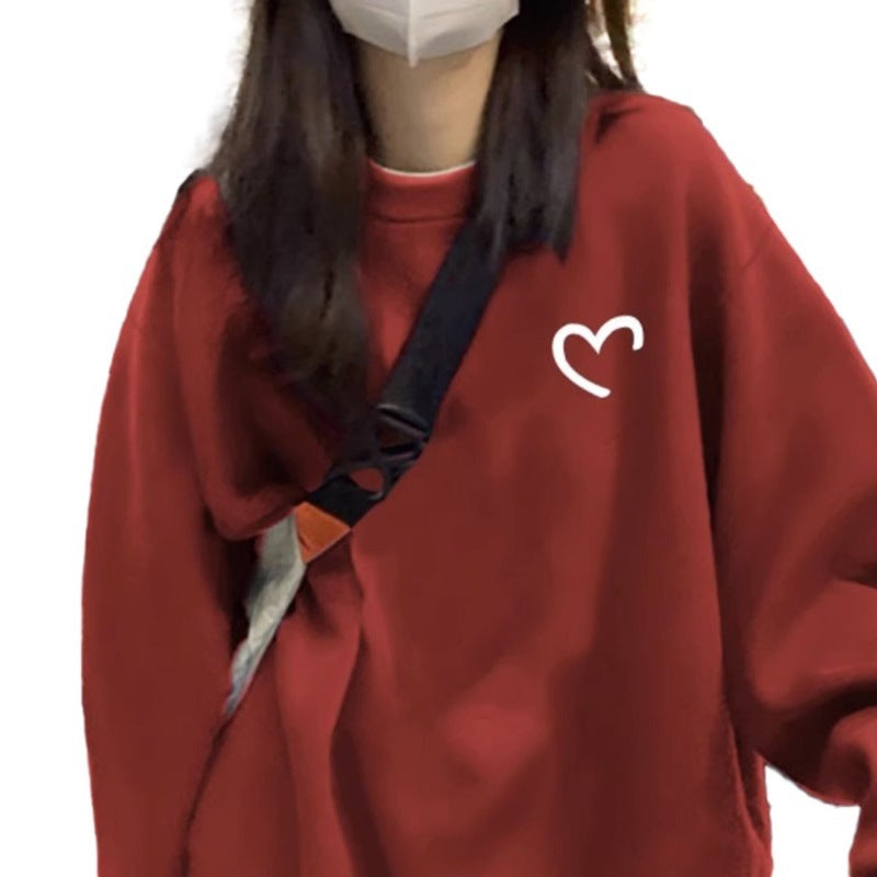 Kvinnors avslappnad oversized tröja med hjärtformad design och bekväma material-Eva Jonsson