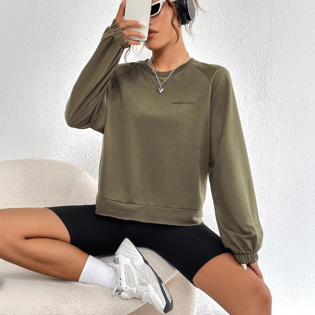 Kvinnors avslappnad raglan sweatshirt med elastiska muddar och minimalistisk design Mirla-Eva Jonsson