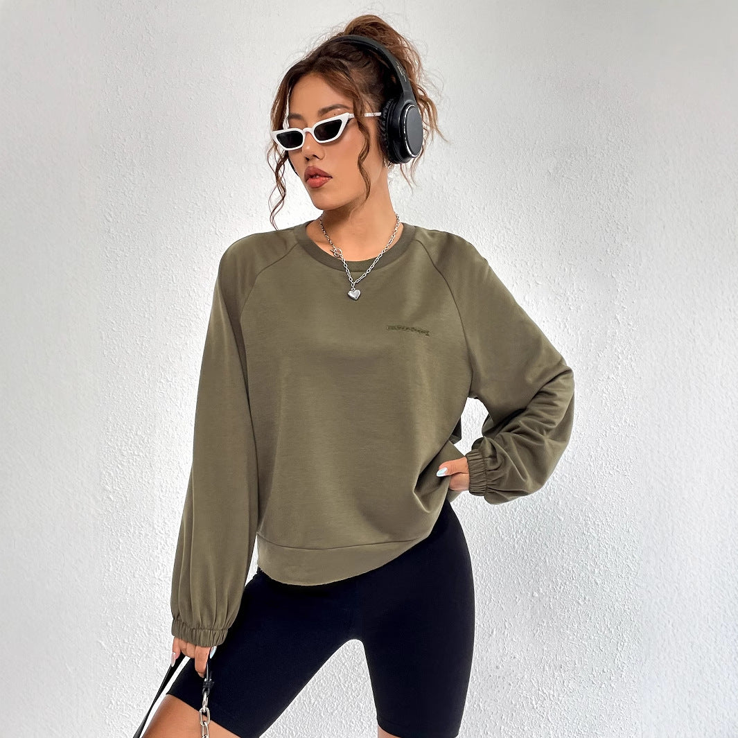 Kvinnors avslappnad raglan sweatshirt med elastiska muddar och minimalistisk design Mirla-Eva Jonsson