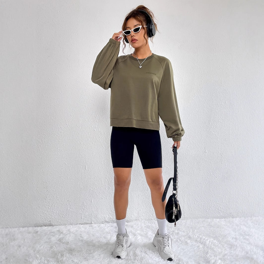Kvinnors avslappnad raglan sweatshirt med elastiska muddar och minimalistisk design Mirla-Eva Jonsson