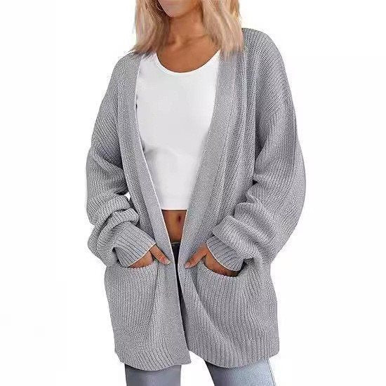 Kvinnors avslappnad stickad cardigan med stora fickor och öppen design Mirla-Eva Jonsson