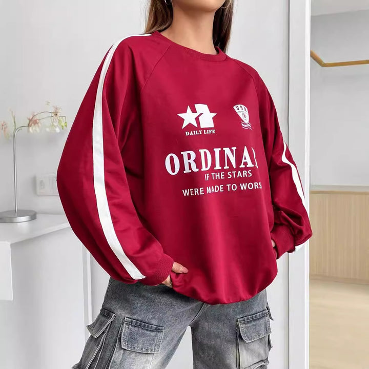 Kvinnors avslappnad sweatshirt med kreativa grafiker och voluminösa ärmar Mirla-Eva Jonsson