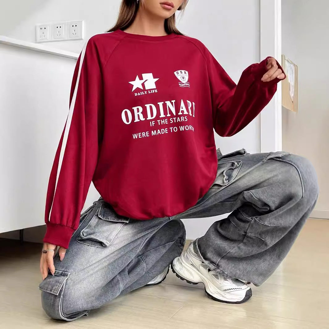 Kvinnors avslappnad sweatshirt med kreativa grafiker och voluminösa ärmar Mirla-Eva Jonsson