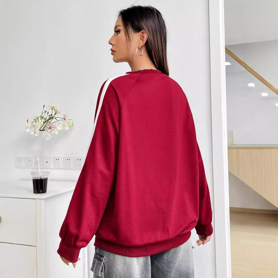 Kvinnors avslappnad sweatshirt med kreativa grafiker och voluminösa ärmar Mirla-Eva Jonsson