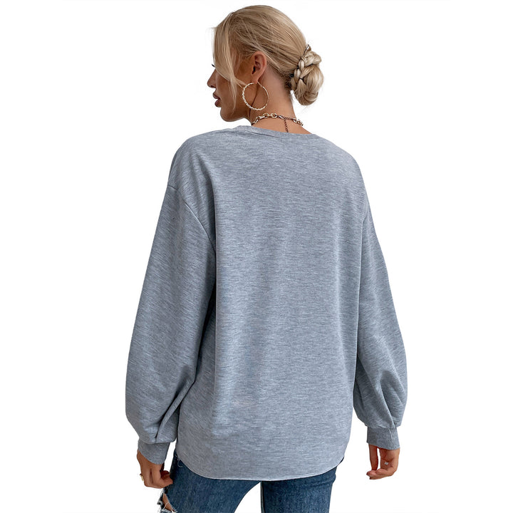 Kvinnors avslappnad sweatshirt med raffinerade puffärmar och kreativ lettering Mirla-Eva Jonsson
