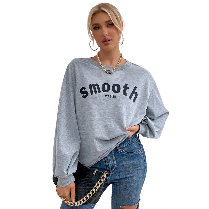 Kvinnors avslappnad sweatshirt med raffinerade puffärmar och kreativ lettering Mirla-Eva Jonsson