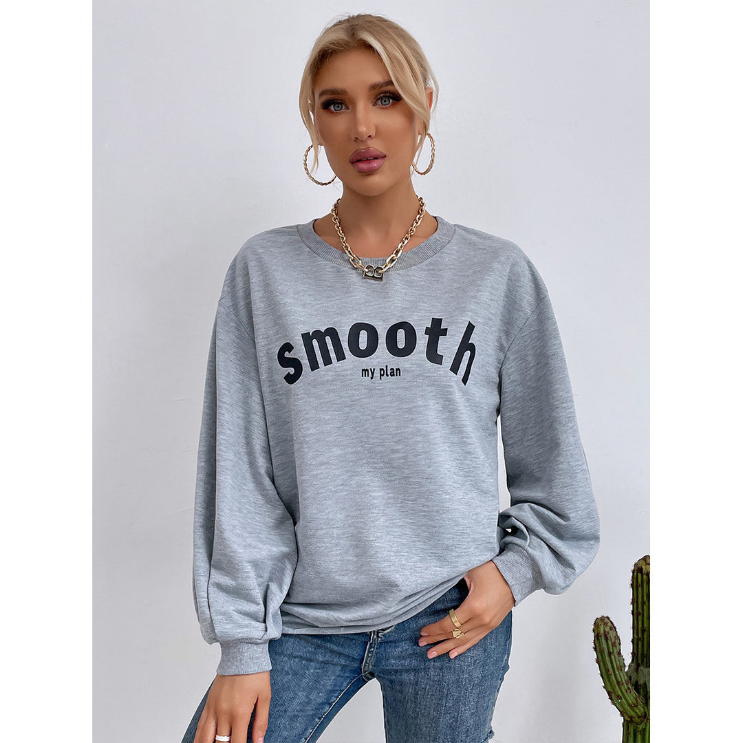 Kvinnors avslappnad sweatshirt med raffinerade puffärmar och kreativ lettering Mirla-Eva Jonsson