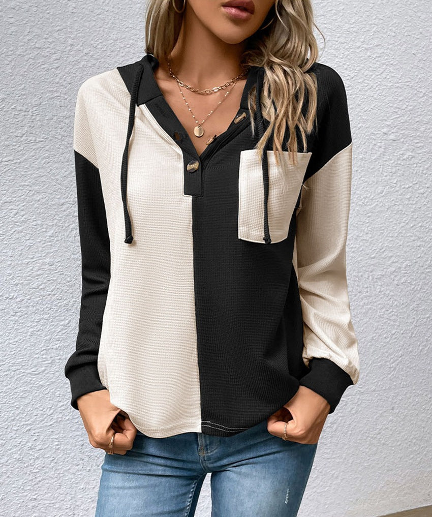 Kvinnors avslappnade hoodie-blus med kontrasterande färger Mirla-Eva Jonsson