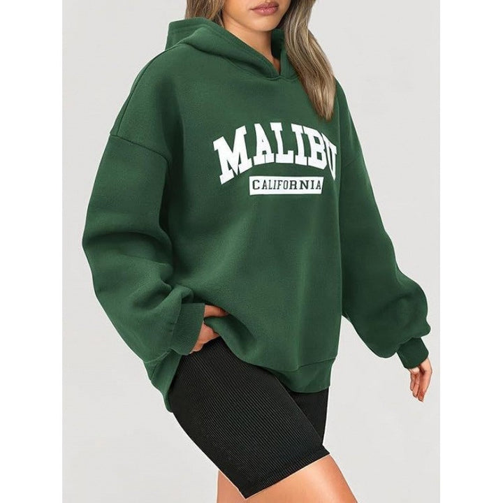 Kvinnors avslappnade hoodie med oversized passform och iögonfallande tryck Mirla-Eva Jonsson
