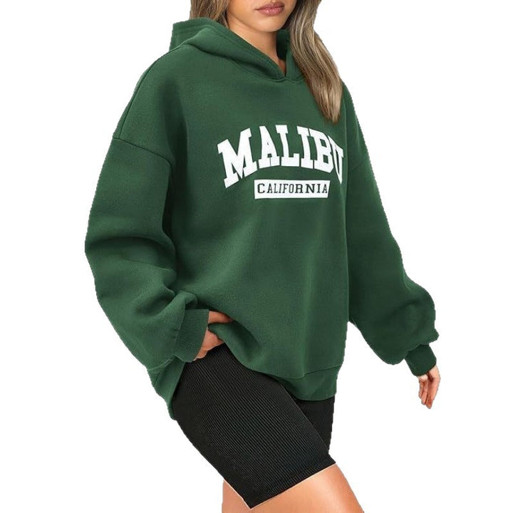 Kvinnors avslappnade hoodie med oversized passform och iögonfallande tryck Mirla-Eva Jonsson