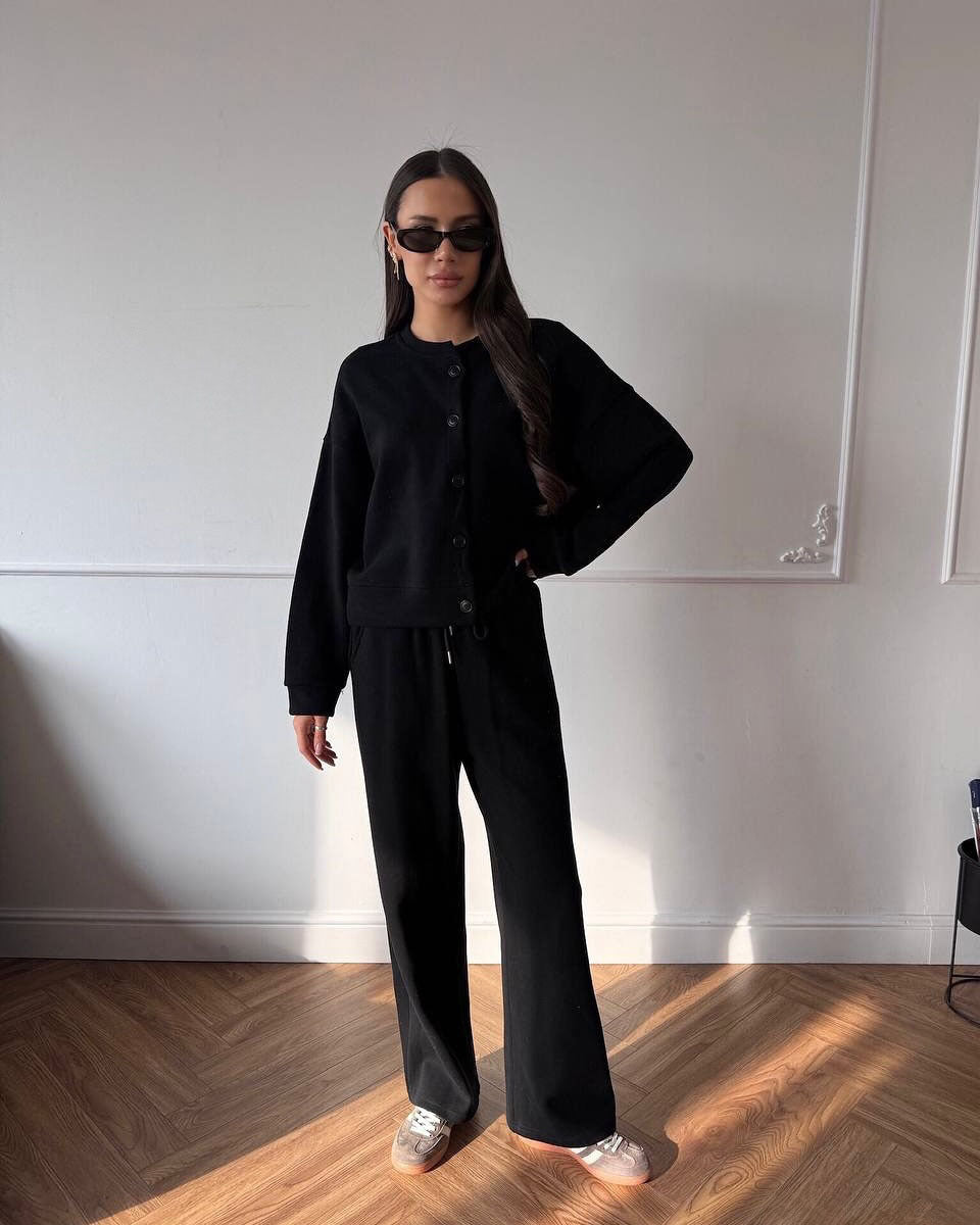 Kvinnors avslappnade hoodie overall med vida ben och knapppdetaljer Mirla-Eva Jonsson