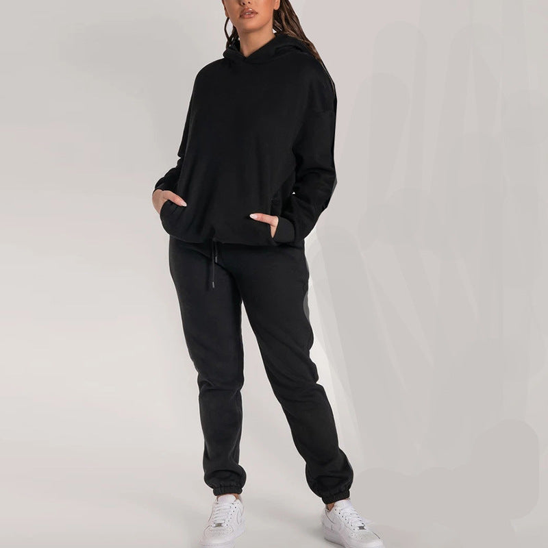 Kvinnors avslappnade hoodie-set med praktiska fickor och elastisk midja Mirla-Eva Jonsson