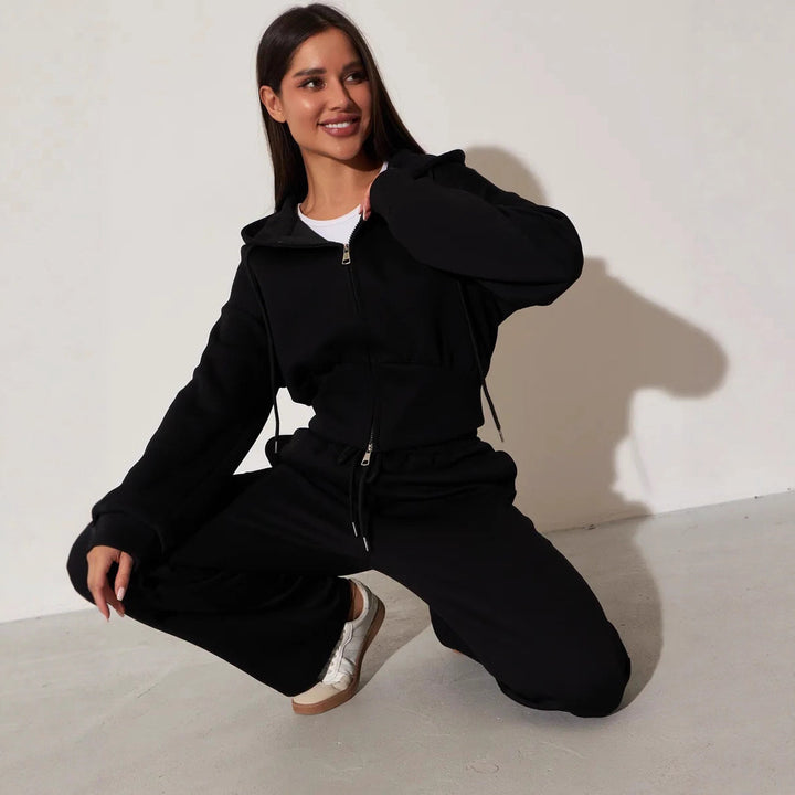 Kvinnors avslappnade hoodie topp och vida sweatpants set med hög midja och dragkedja Mirla-Eva Jonsson
