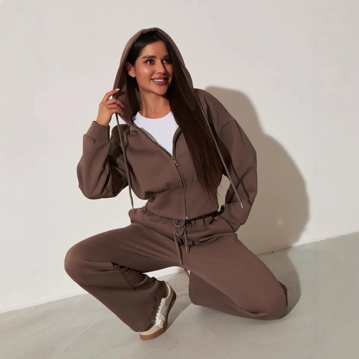 Kvinnors avslappnade hoodie topp och vida sweatpants set med hög midja och dragkedja Mirla-Eva Jonsson