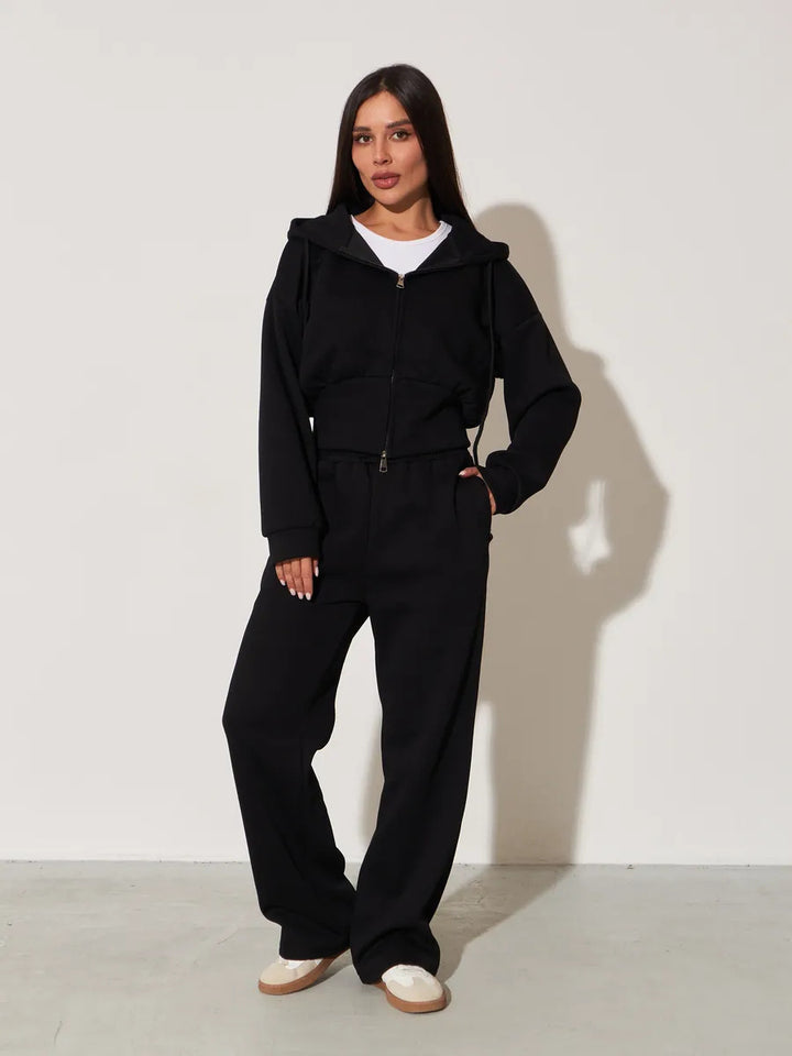 Kvinnors avslappnade hoodie topp och vida sweatpants set med hög midja och dragkedja Mirla-Eva Jonsson