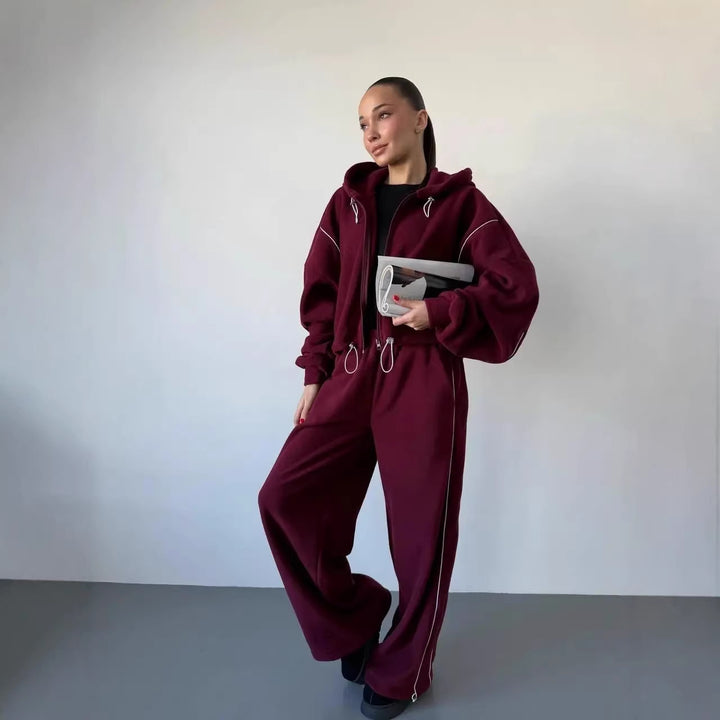 Kvinnors avslappnade hoodie träningsoverall med lösa byxor och sidoremsa Mirla-Eva Jonsson