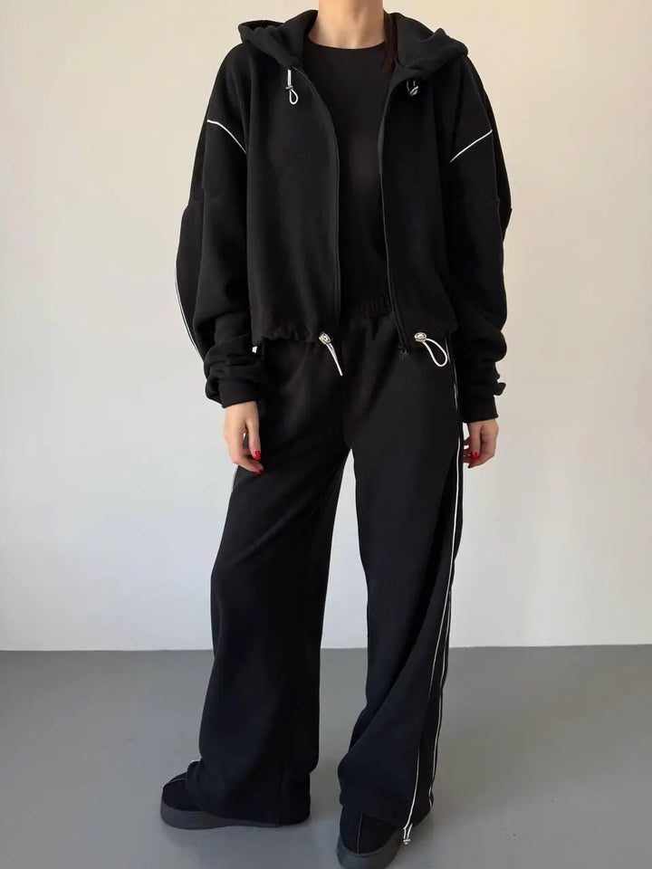 Kvinnors avslappnade hoodie träningsoverall med lösa byxor och sidoremsa Mirla-Eva Jonsson