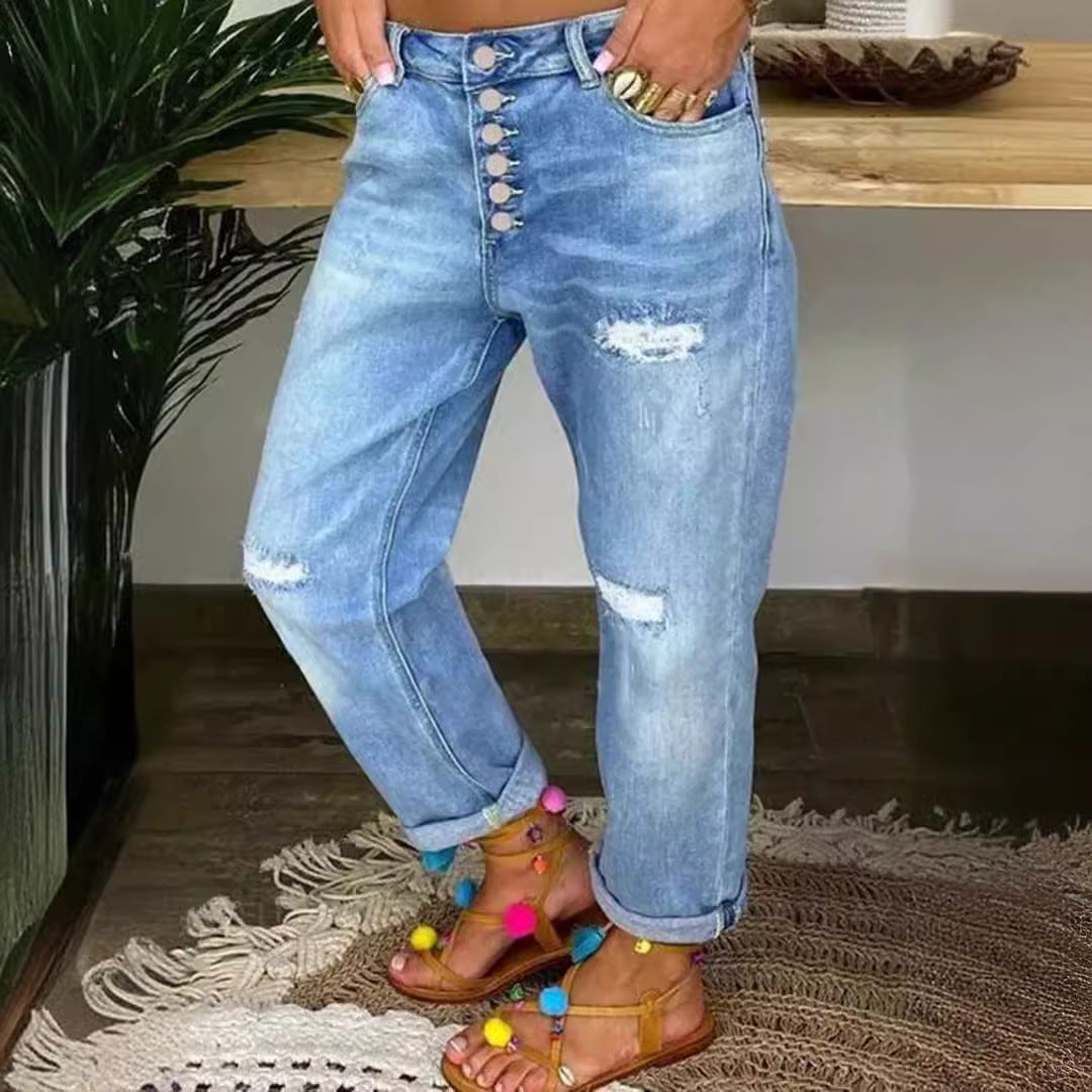 Kvinnors avslappnade jeans med hög knäppning och slitna detaljer Mirla-Eva Jonsson