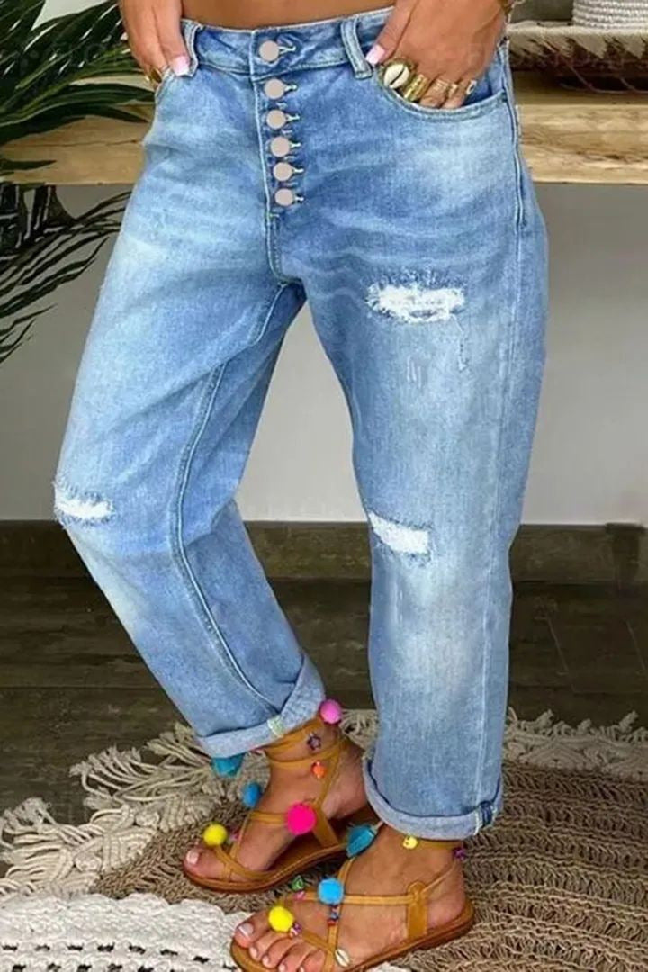 Kvinnors avslappnade jeans med hög knäppning och slitna detaljer Mirla-Eva Jonsson