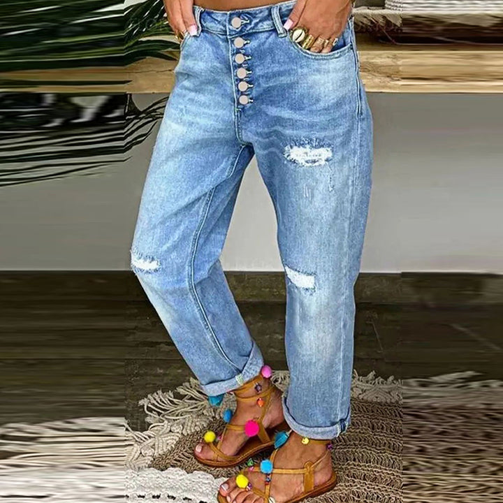 Kvinnors avslappnade jeans med hög knäppning och slitna detaljer Mirla-Eva Jonsson