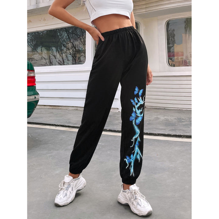 Kvinnors avslappnade joggingbyxor med färgglad fjäril och blixtdesign Mirla-Eva Jonsson