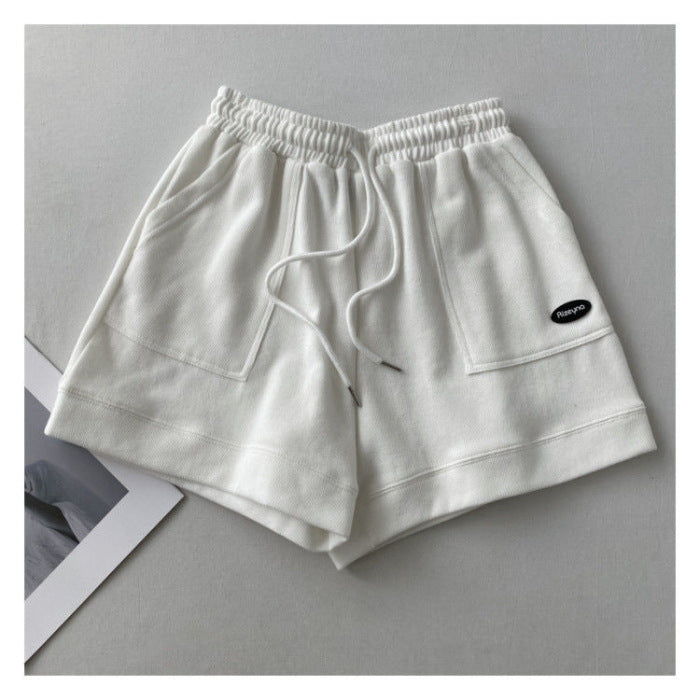 Kvinnors avslappnade joggingshorts med elastisk midja och praktiska sidofickor-Eva Jonsson