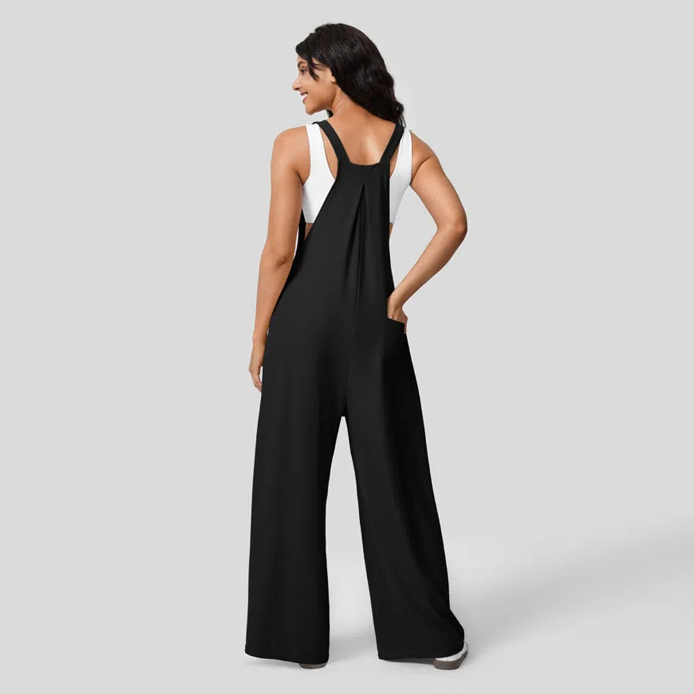 Kvinnors avslappnade jumpsuit med breda ben och elegant knappdetalj Mirla-Eva Jonsson