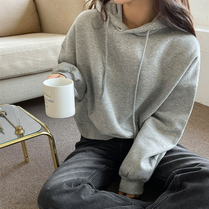 Kvinnors avslappnade kort hoodie med voluminösa ärmar Mirla-Eva Jonsson