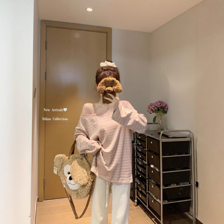 Kvinnors avslappnade oversized avskuren axel långärmad skjorta med randigt mönster Mirla-Eva Jonsson