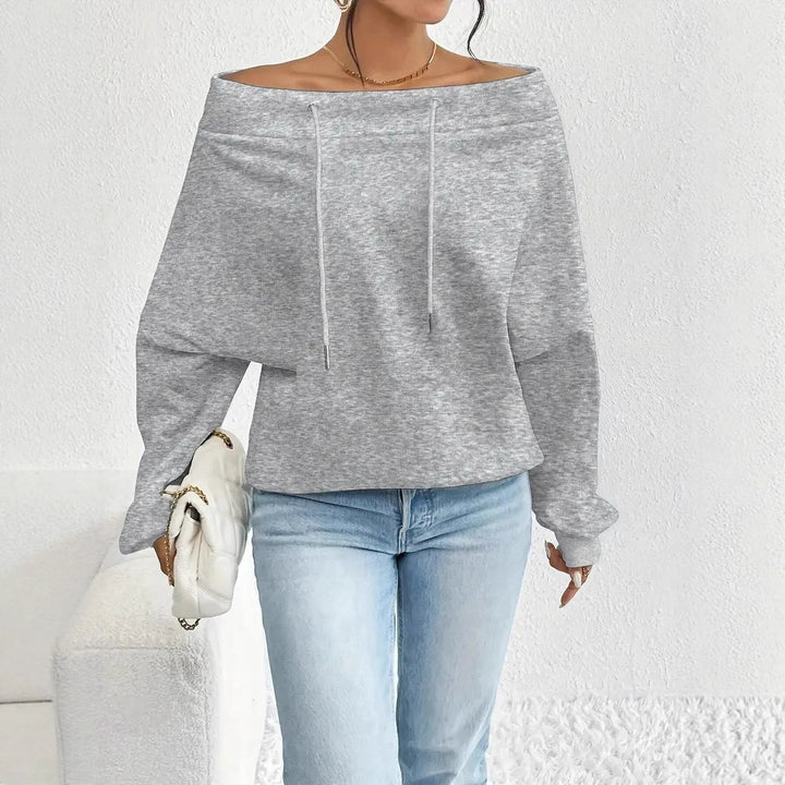 Kvinnors avslappnade oversized pullover med öppen krage och praktiska dragsnören Mirla-Eva Jonsson