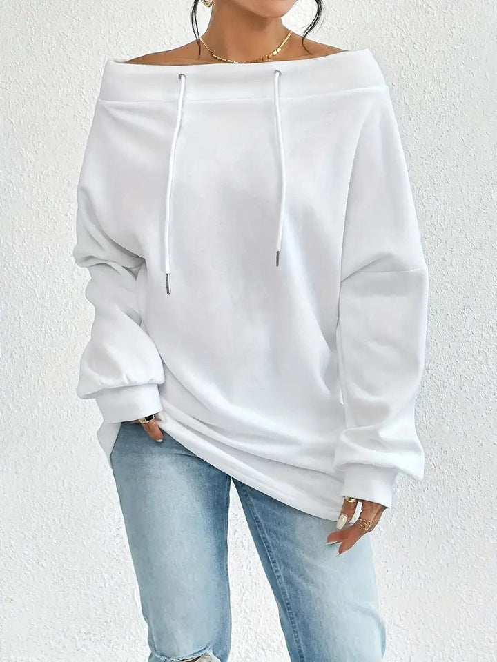 Kvinnors avslappnade oversized pullover med öppen krage och praktiska dragsnören Mirla-Eva Jonsson