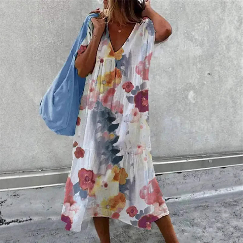Kvinnors avslappnade sommardress med V-ringning och voluminös kjol Mirla-Eva Jonsson