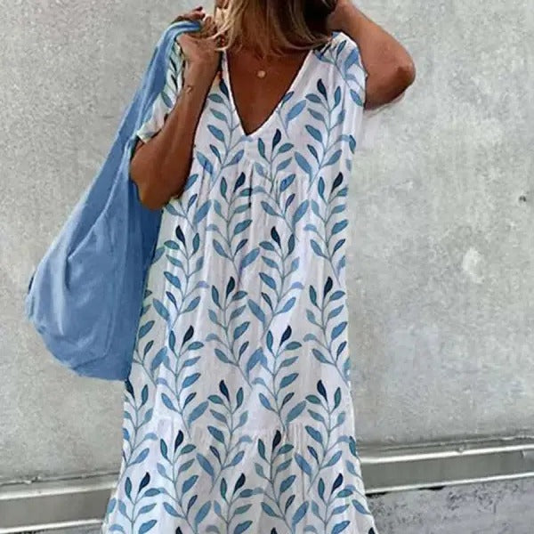 Kvinnors avslappnade sommardress med V-ringning och voluminös kjol Mirla-Eva Jonsson
